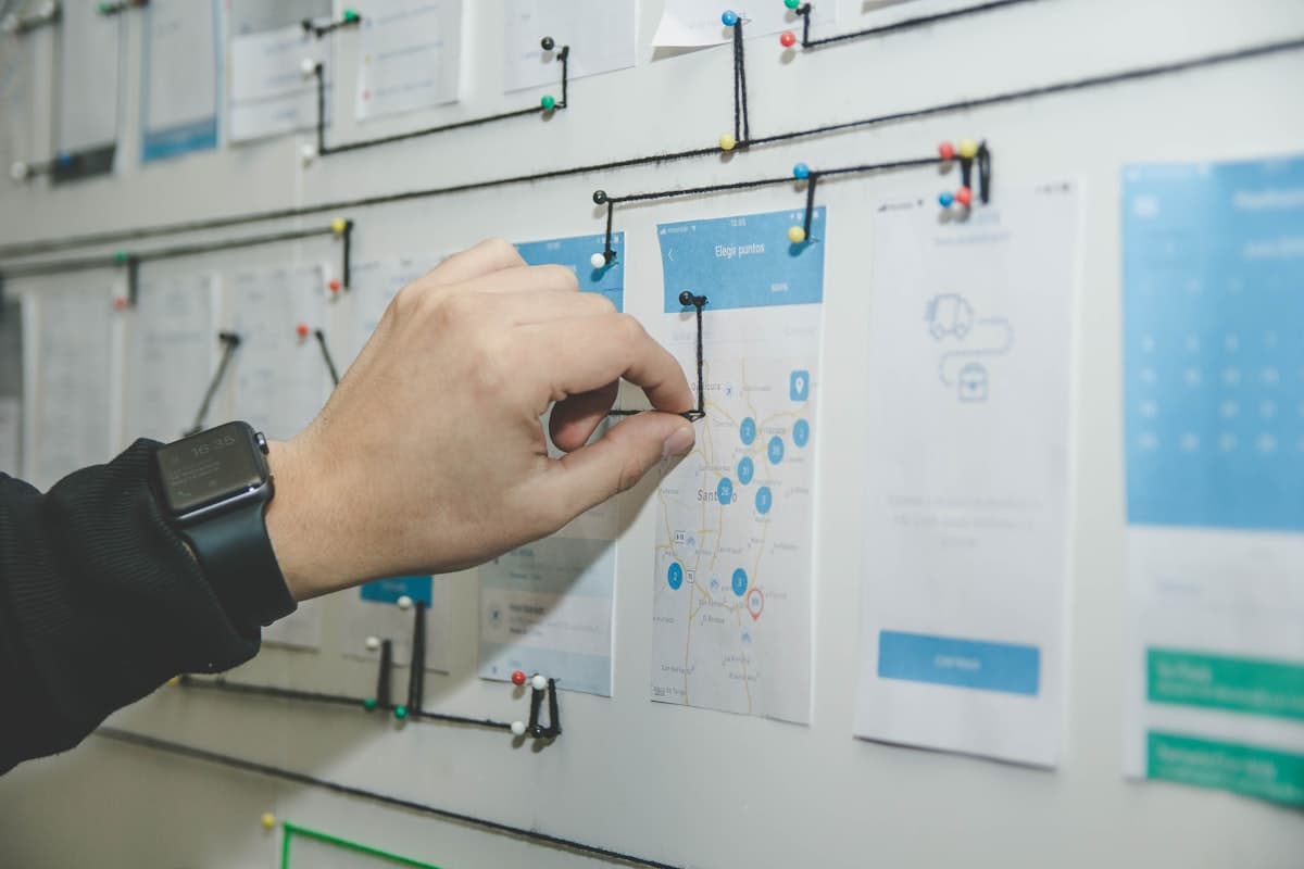 Strategists reviewing client results on a whiteboard
